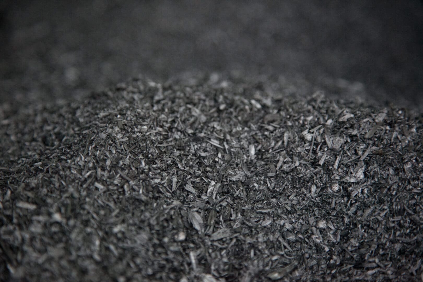 A close up of a pile of black biochar.