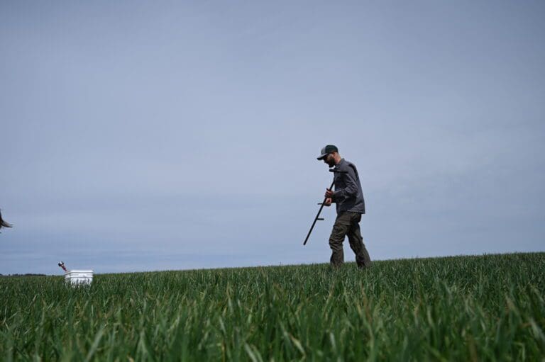 a person walking through a field.