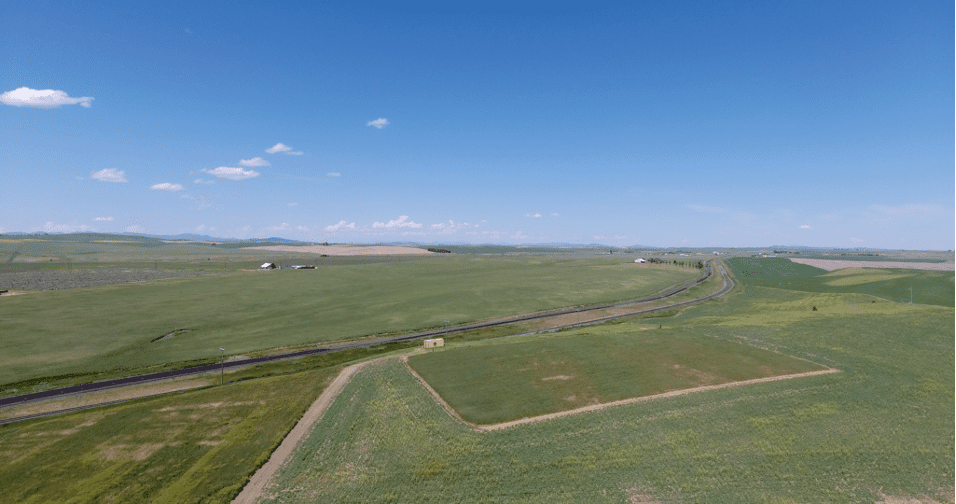 a green field from the sky.