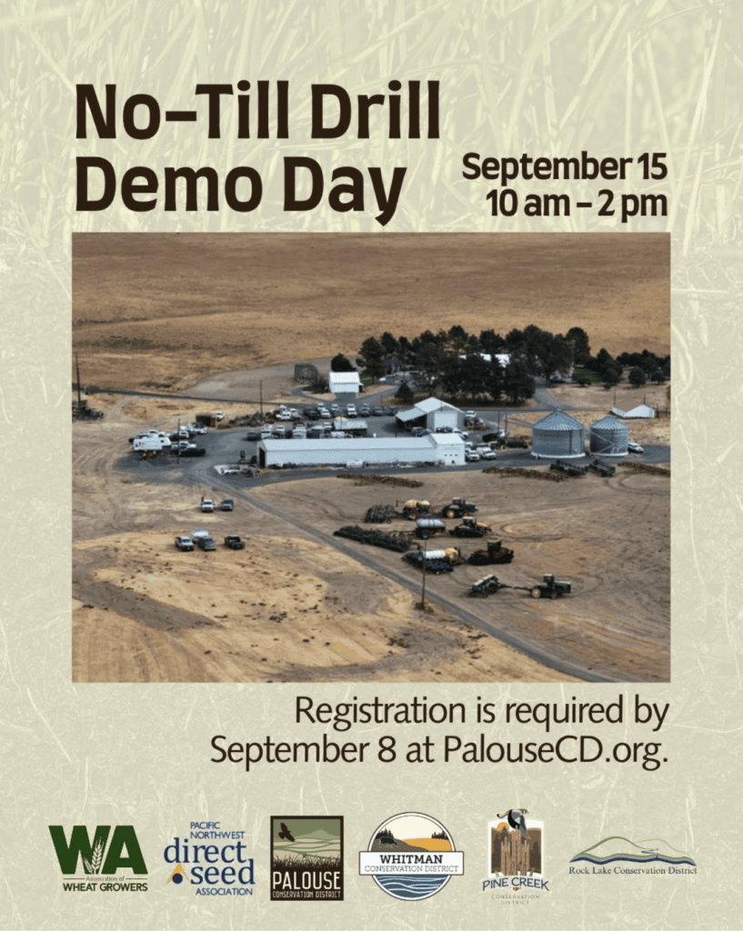 Promotional flyer for a “No-Till Drill Demo Day” event. Large text at the top reads “No-Till Drill Demo Day,” with “September 15, 10 am–2 pm” on the right. The center features an aerial photograph of a farm facility in a dry agricultural landscape, showing buildings, grain bins, parked vehicles, and farm equipment arranged in an open lot. Beneath the photo, text states: “Registration is required by September 8 at PalouseCD.org.” Along the bottom are logos for the Washington Association of Wheat Growers, Pacific Northwest Direct Seed Association, Palouse Conservation District, Whitman Conservation District, Pine Creek Conservation District, and Rock Lake Conservation District. The background has a muted grass-texture design.